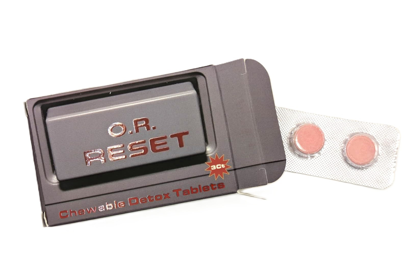 O.R. Reset detox tablet packaging with two pink tablets on a white background